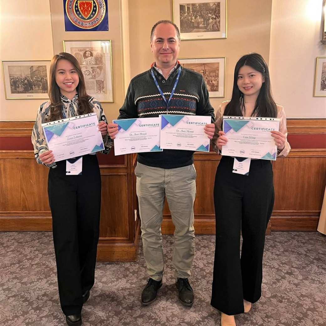 508851 Zeren Lelaona, Lina Weng, and Dr. Amir Moradi smile and show off their co-authorship certificates
