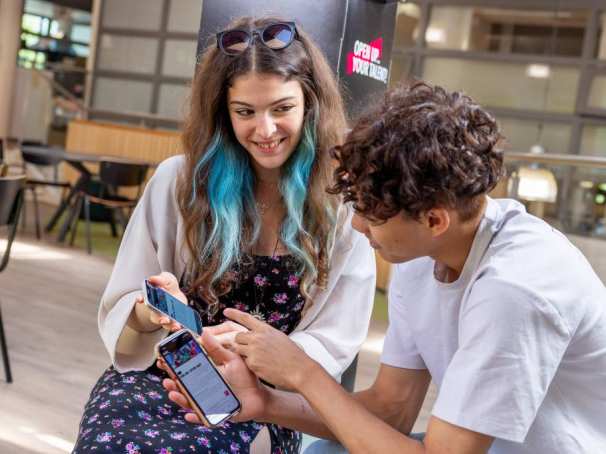 International students signing up for the Online Open Day on their phones. 