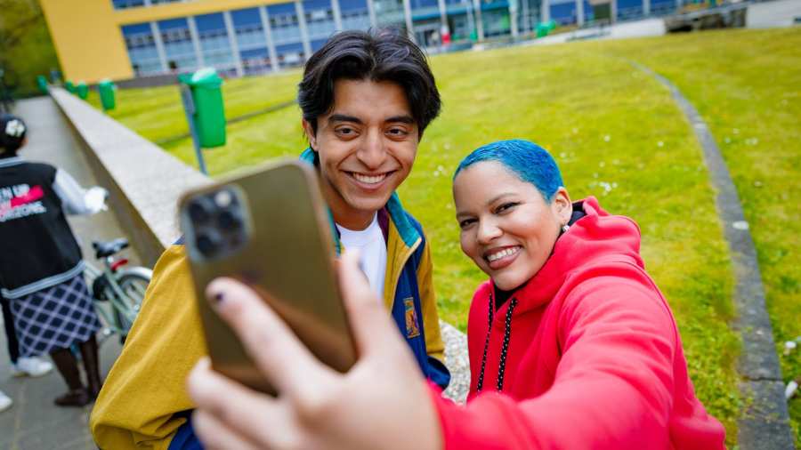 Diego and Chadionne smiling and taking a selfie at Arnhem Campus