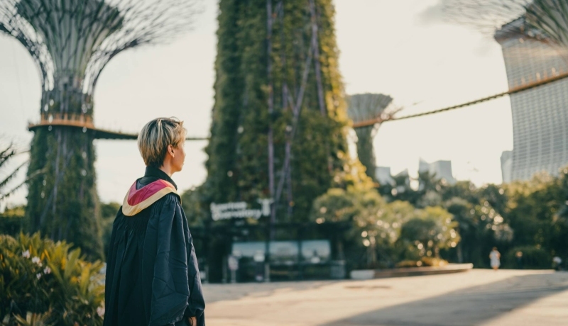 Photo of a graduate looking into the horizon. Photo is from Unsplash