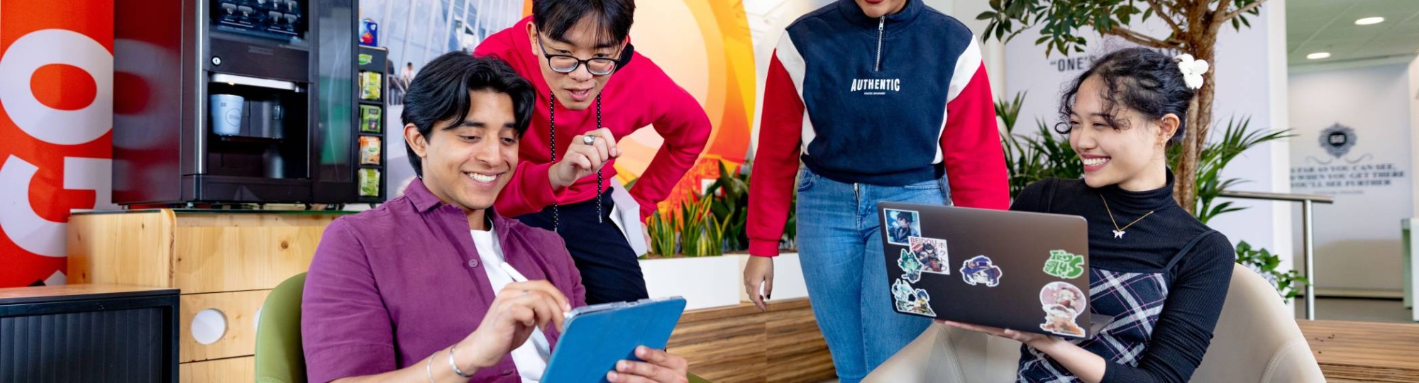 International students studying in the lounge on the Arnhem campus of HAN University of Applied Sciences. 