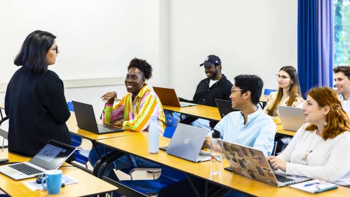 a lecturer helping a student