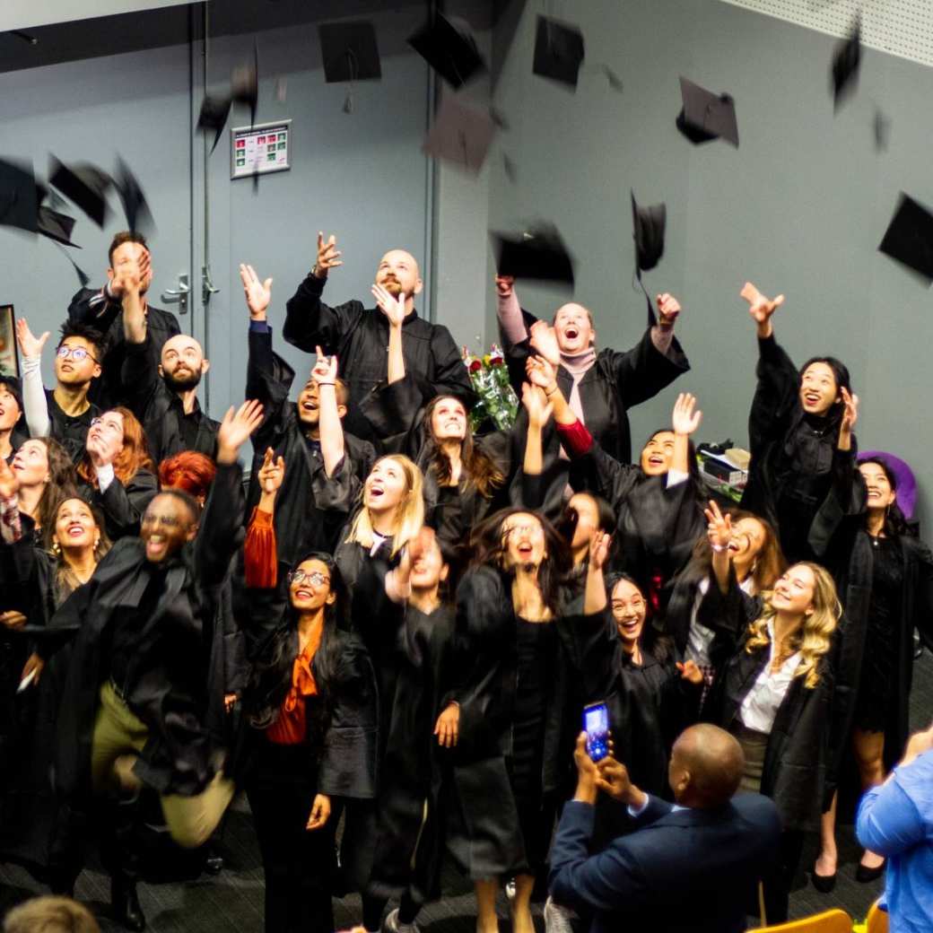 The picture shows the throwing of the hat by ISB graduates.