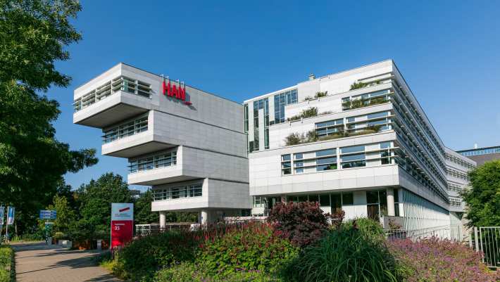 HAN University of Applied Sciences photo of the futuristic building and logo on Nijmegen campus Kapittelweg 35